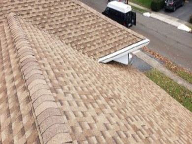 A brown shingled roof and a parked car, illustrating a roofing design animation set in New Jersey.